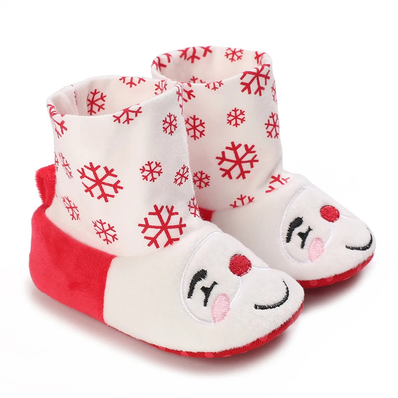 Pair of adorable animal-themed baby first walker shoes with red and white snowflake patterns