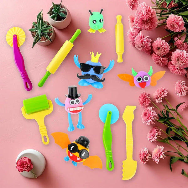 Ensemble d'outils de pâte à modeler créatifs et colorés : spatules, rouleaux et accessoires de modelage sur fond rose.