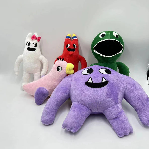 A collection of colorful plush toys including a white rabbit, a red dinosaur, a green monster, and a purple alien.