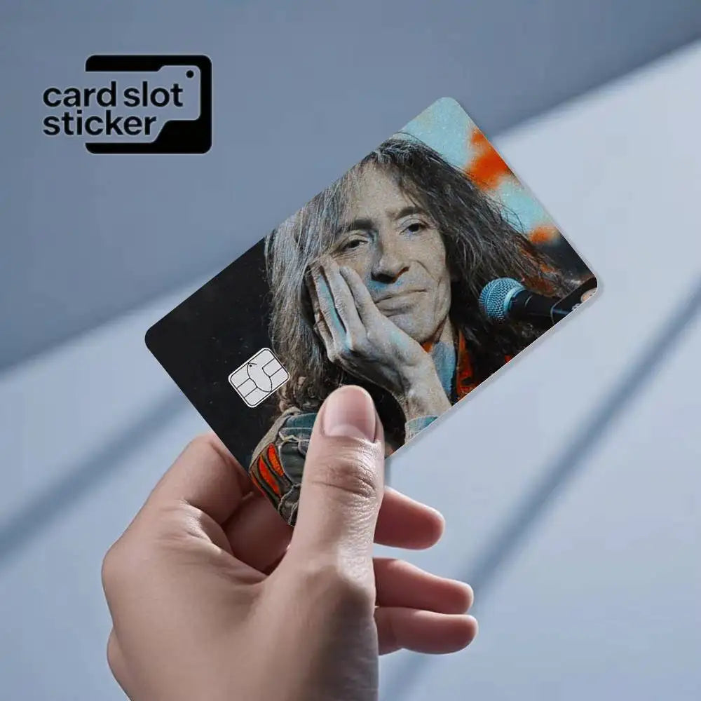 A hand holds up a black card slot sticker featuring a portrait of Jimi Hendrix.