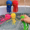 Colorful squeeze water octopus bath toys floating in a bathtub
