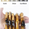 A set of bamboo-style bag handles in gold, silver, and gunblack finishes are displayed alongside natural wood handles.