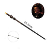 An elegant metal cosplay magic wand with a decorative handle and a small portrait inset.