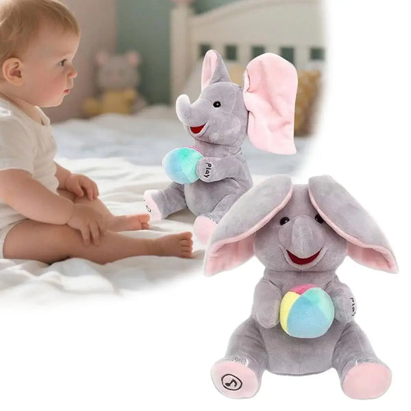 A gray elephant plush toy with pink ears and a colorful ball is shown next to a baby.