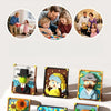 A set of pixel art building blocks featuring various family and portrait scenes.