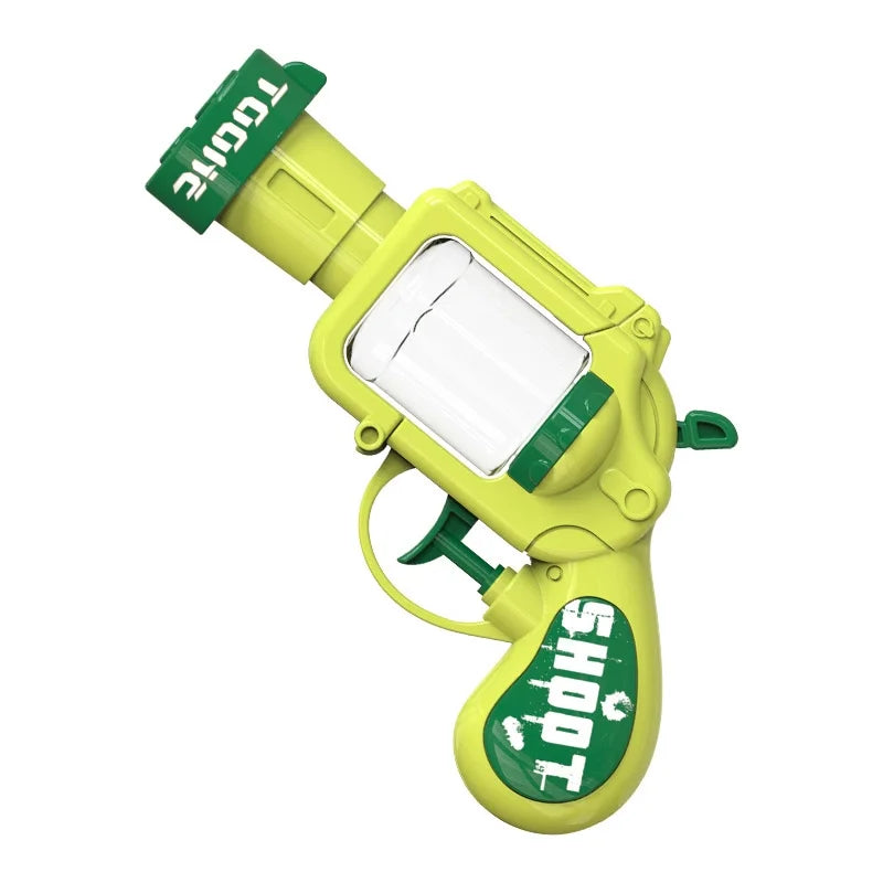 A yellow mini water blaster pistol with a green nozzle and a clear water tank.