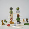 A wooden animal stacking block toy featuring various forest animals like a hedgehog, elephant, and deer.