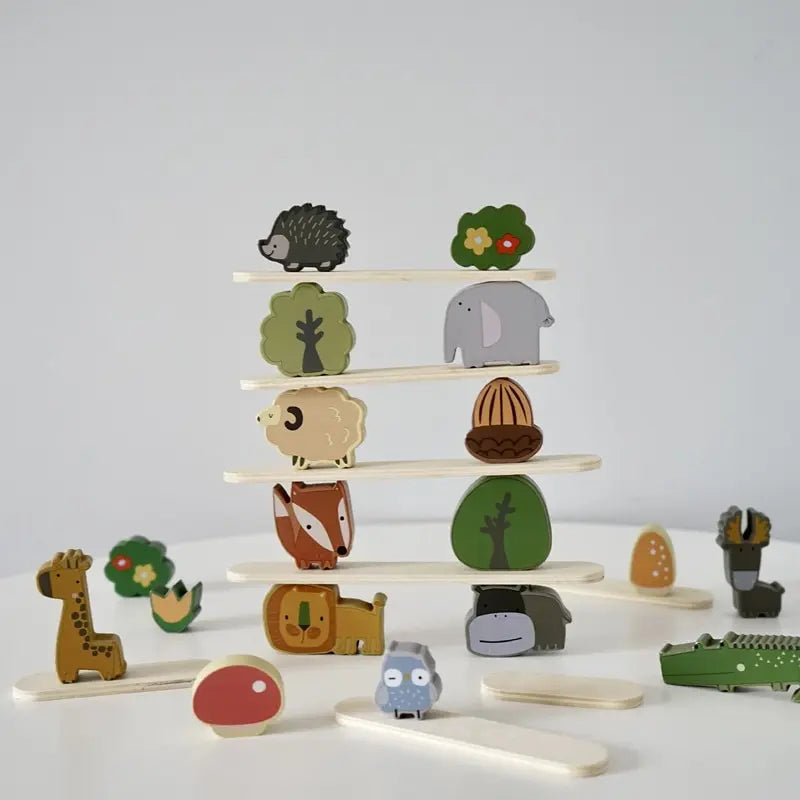 A wooden animal stacking block toy featuring various forest animals like a hedgehog, elephant, and deer.