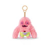 Pink fuzzy monster plush keychain with a round head and green shorts