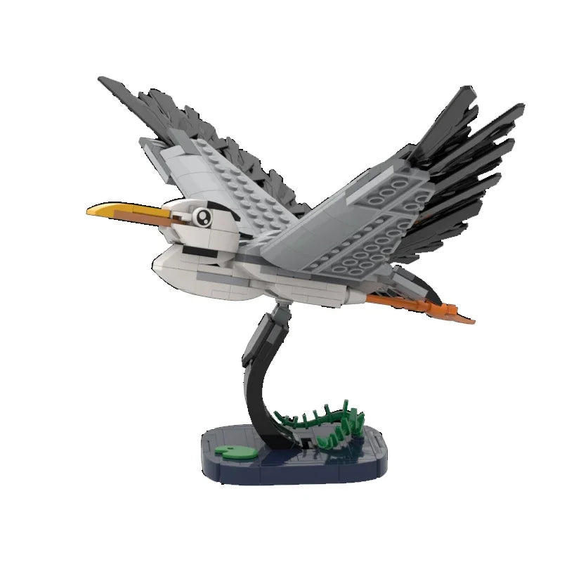 A gray and orange animal model building block set shaped like a bird of prey.