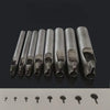 A row of precision leather hole punches for belts and crafting tools displayed on a dark surface.