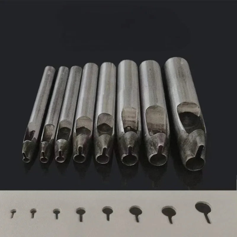 A row of precision leather hole punches for belts and crafting tools displayed on a dark surface.