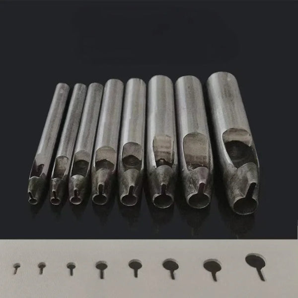 A row of precision leather hole punches for belts and crafting tools displayed on a dark surface.