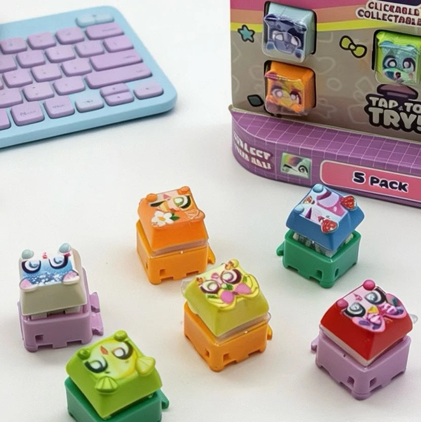 A collection of colorful fidget keychains and a purple mechanical keyboard are displayed on a white surface.
