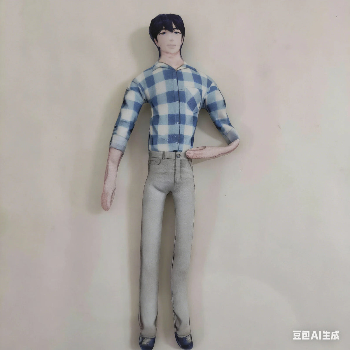 A poseable plush doll figure wearing a blue and white plaid shirt and gray pants, standing against a light background.