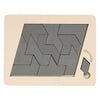 A wooden geometric brain teaser puzzle featuring interlocking gray puzzle pieces on a light beige background.