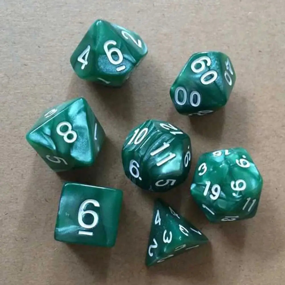 A collection of ten green acrylic polyhedral dice scattered on a brown surface.