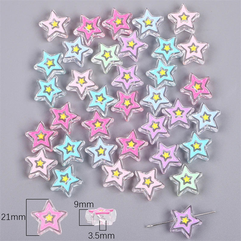 A collection of colorful enamel star-shaped charm beads in various shades of pink, blue, and purple.
