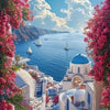 A scenic view of white architecture overlooking the sea with pink cherry blossoms in the foreground.