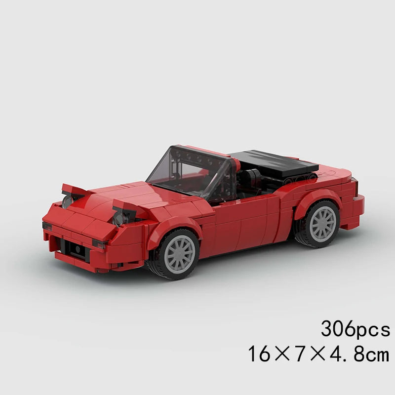 A red classic rally car model built from LEGO bricks, shown in a side view.