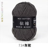 A skein of dark gray milk cotton yarn labeled with Chinese characters and the number 73