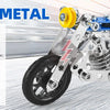 A blue and silver metal building motorcycle construction kit with wheels and engine components shown on a white background.