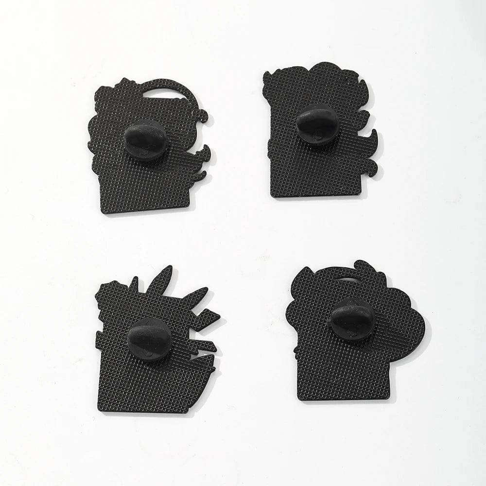 A set of four black cartoon enamel pins featuring cute animal faces for bags and clothes.