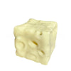 A white cheese cube stress ball with visible holes, used as a fidget toy.