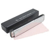 A silver 24-hole tremolo harmonica in C is shown next to its black protective case.