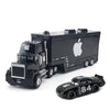 A black diecast toy hauler truck with an Apple logo and a separate black sports car labeled 84.