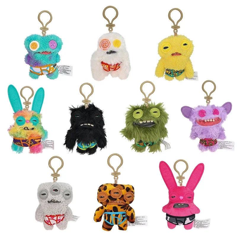 A collection of 12 cm Fuggler funny plush monster keychains featuring various quirky designs including a blue monster, white 