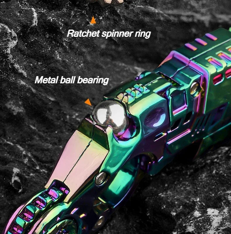 Close-up of a metallic green toy pistol with a ratchet spinner ring and metal ball bearing components.