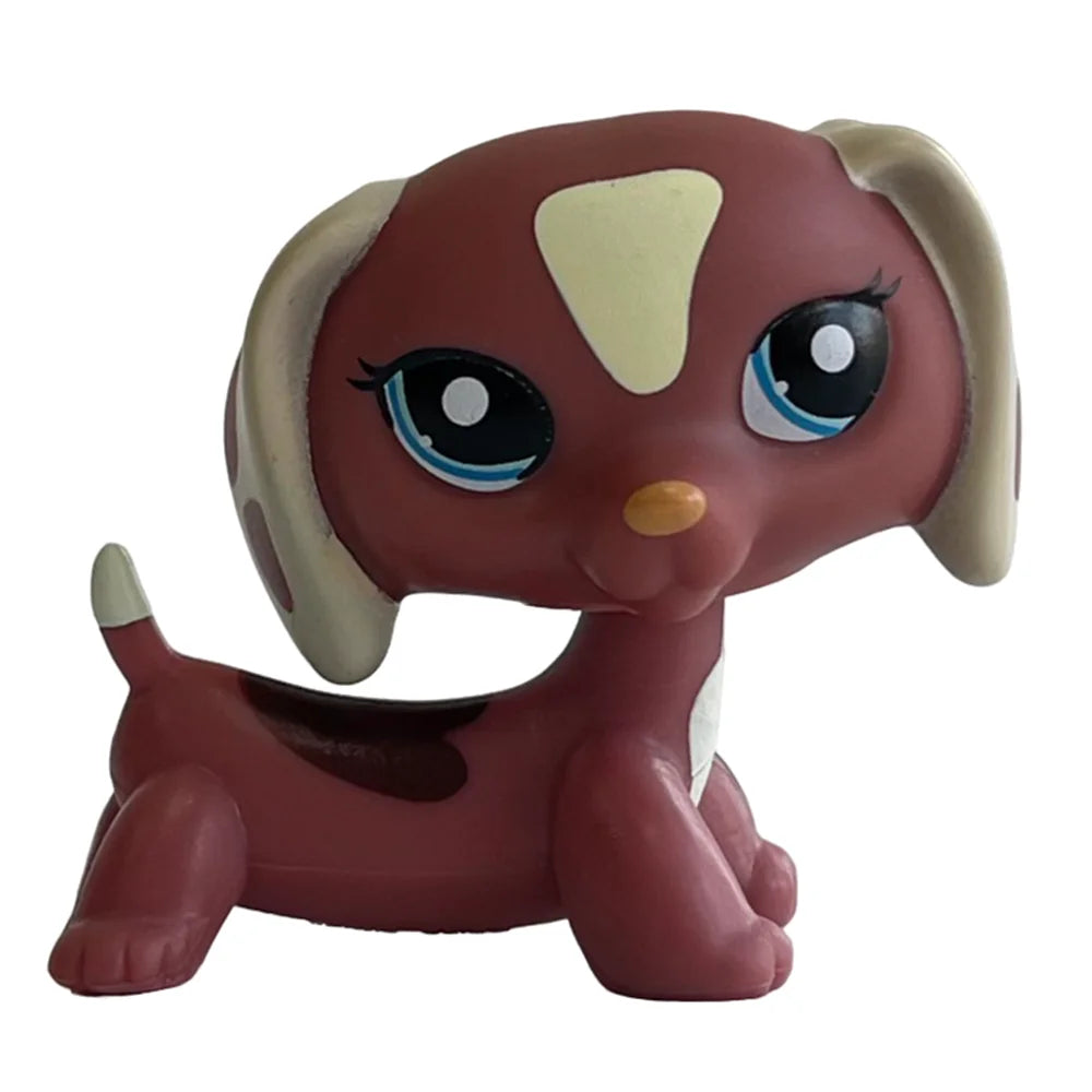 A small, brown Bobbing Deer bobblehead toy with large blue eyes and a light tan face.