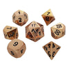 A set of polyhedral dice with a multicolor gold finish, including a d6, d8, d10, d12, d20, and d60.