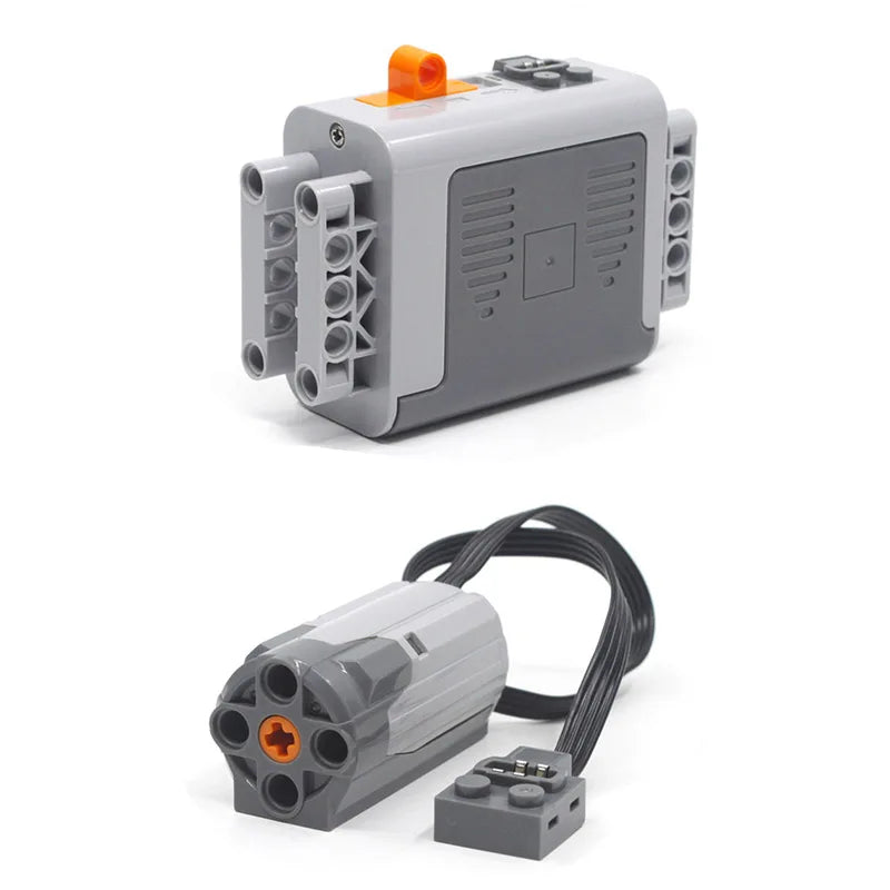 A gray technical power functions motor set for building blocks with an orange component and attached wires.