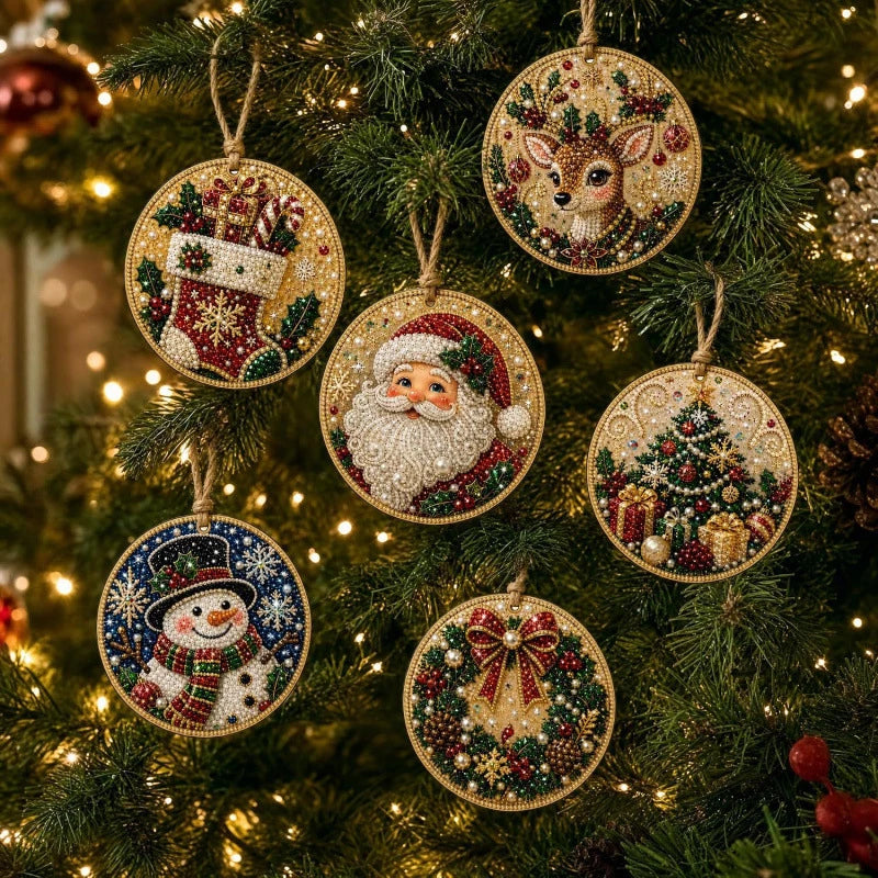 A close-up of various Christmas diamond painting ornaments hanging on a green fir tree.