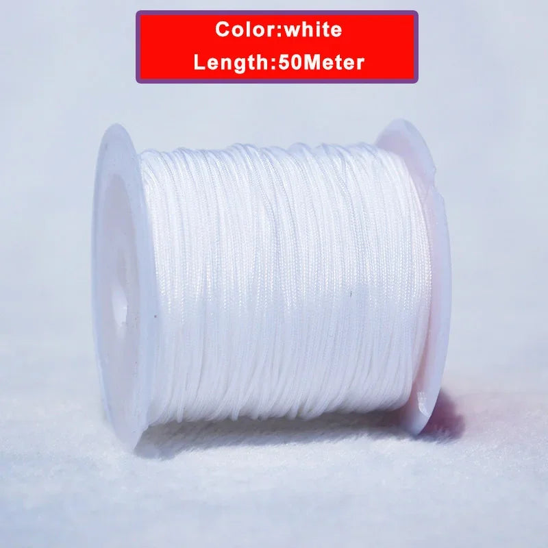 White nylon knotting cord with a 50-meter length coiled on a white surface.