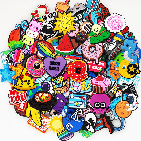A colorful assortment of DIY PVC shoe charms for sandals and bags featuring various shapes, characters, and designs.
