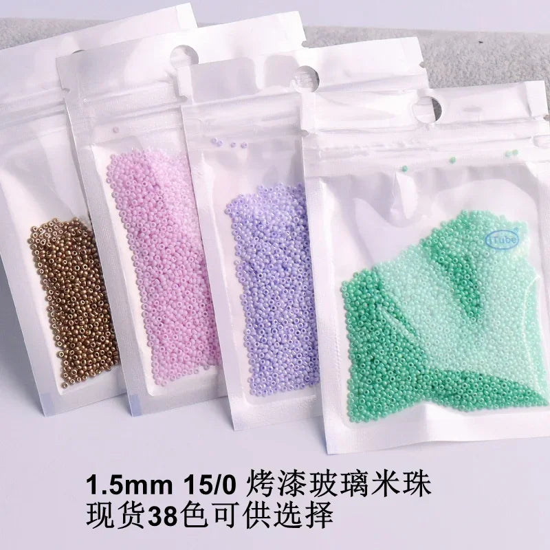 Assortment of 1.5mm solid glass seed beads in various colors, packaged for jewelry and craft.