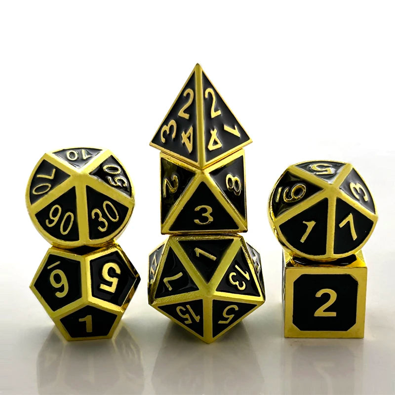 A set of premium metal polyhedral dice with a multicolor gold finish, including a dodecahedron and an icosahedron.