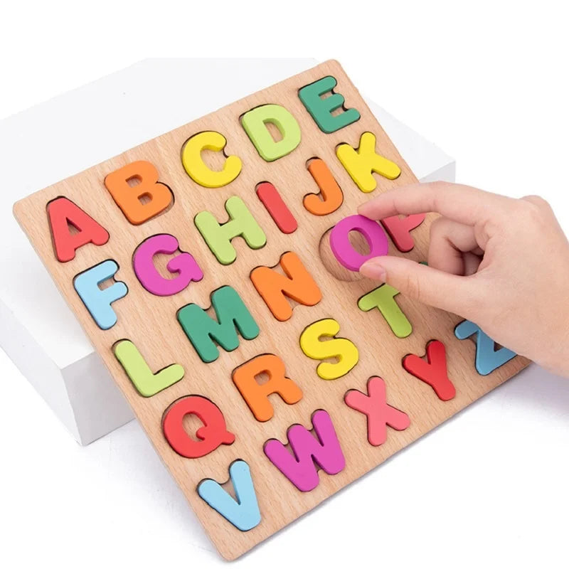 A wooden alphabet puzzle with colorful letters A through Z is being held by a hand.