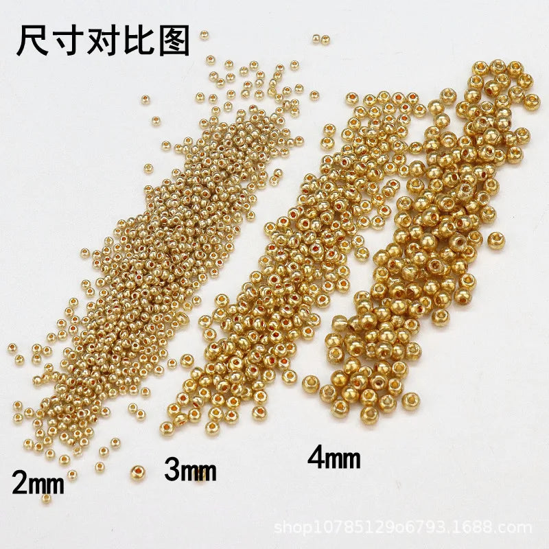 Comparison of electroplated metallic glass beads in various sizes: 2mm, 3mm, and 4mm.