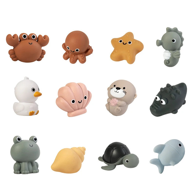 A collection of various silicone bath toys shaped like sea creatures, including turtles, seals, and other marine animals.