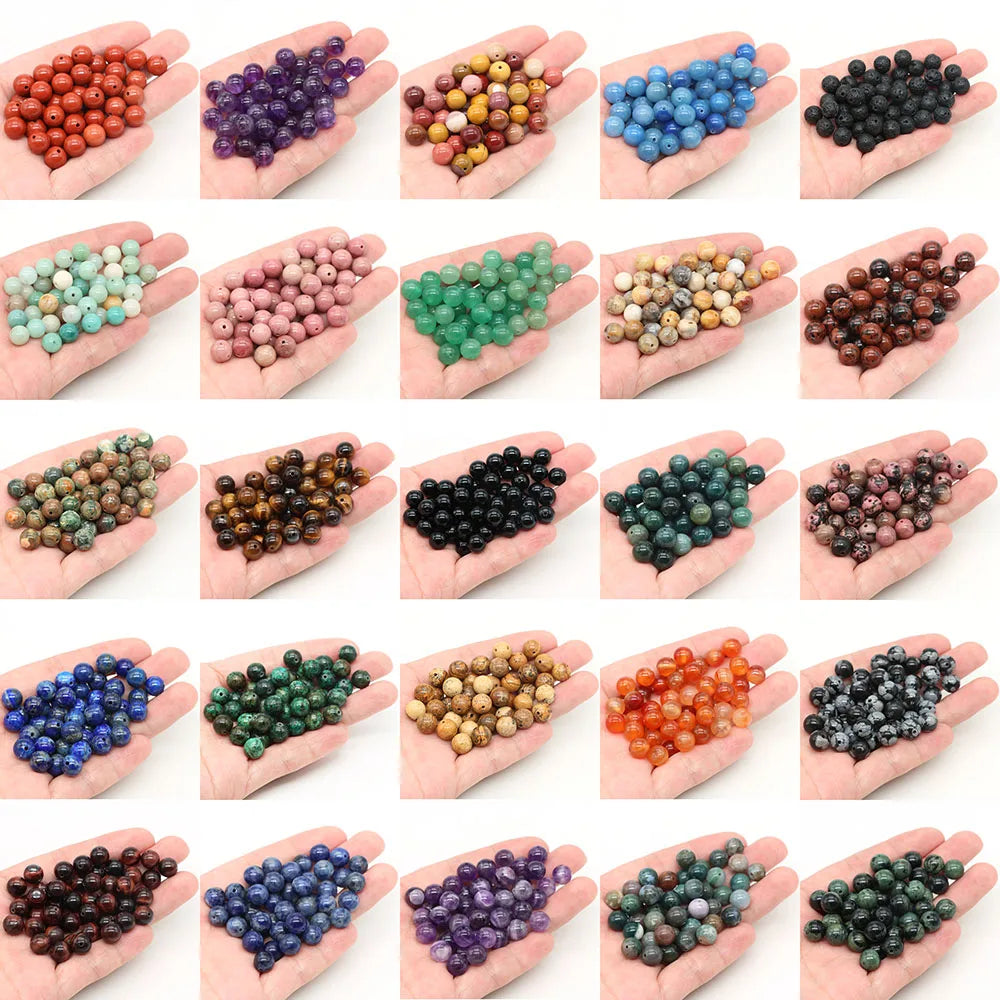 Assortment of natural stone round beads including rose quartz, amethyst, and red silk jade for jewelry making