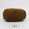 A ball of olive brown pre-dyed milk cotton yarn, 50g, used for knitting and crochet.