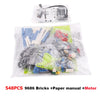 A plastic bag containing a set of 548 pieces of 9686 building blocks, a paper manual, and a motor.