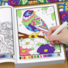 An open color by number book showing a bird and flowers for adults to color.