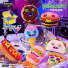 A collection of Fuggler Ugly Cute Monster plush toys and food-themed items including donuts, burgers, and a monster ice cream