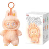 A fluffy peach-colored Labubu The Monsters plush doll with a pink hook.