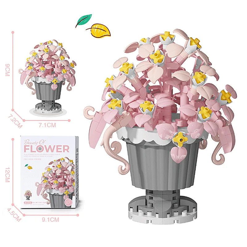 A pink and yellow building block flower bouquet kit featuring roses and sunflowers displayed in a gray pot.